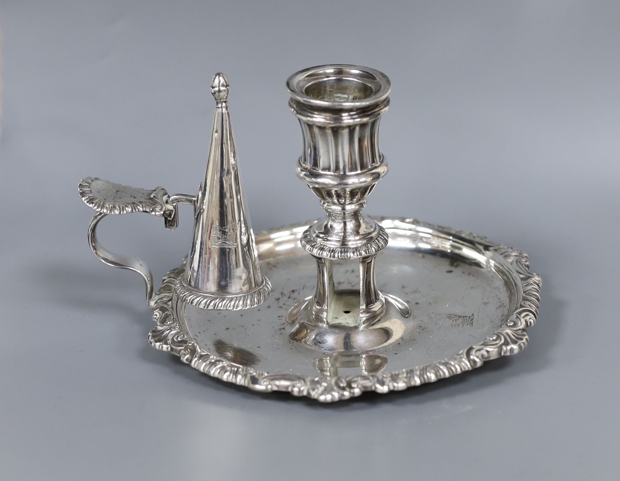 A George III silver chamberstick, John & Thomas Settle, Sheffield, 1818, lacking sconce, 16cm, 9oz.